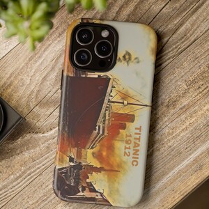 May include: A phone case with a vintage-style image of the Titanic ship. The image is in shades of orange, red, and yellow, with the text "TITANIC 1912" printed on the side.