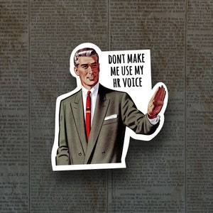 May include: A sticker featuring a man in a suit with a red tie, holding up his hand and saying "Don't make me use my HR voice".