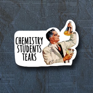 May include: A sticker with the text "CHEMISTRY STUDENTS TEARS" and a vintage illustration of a man in a lab coat holding a flask and a funnel. The background is a collage of old newspaper clippings.