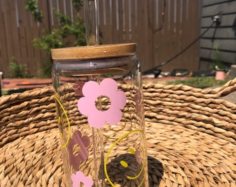 Yellow smiley face and pink flowers cup
