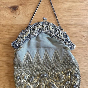 19th century purse with cherub silver clasp