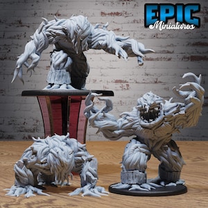May include: Three grey unpainted resin miniature figures depicting hulking, plant-like creatures with textured, vine-covered bodies and wide, toothy maws. The figures are displayed on circular black bases, with one elevated on a dark pedestal.
