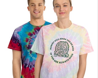 May include: Two tie-dye t-shirts with a green circle graphic featuring a cartoon image of Albert Einstein and the text "Nobody will know you're high if you are always high".