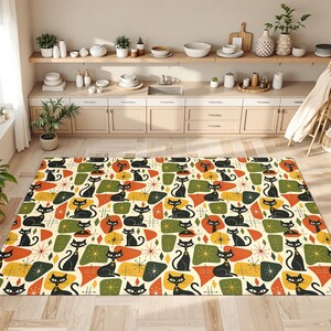 May include: A rectangular area rug featuring a repeating pattern of black cats interspersed with orange, olive green, and yellow geometric shapes and starburst motifs on a cream background. The design covers the entire surface of the floor covering.