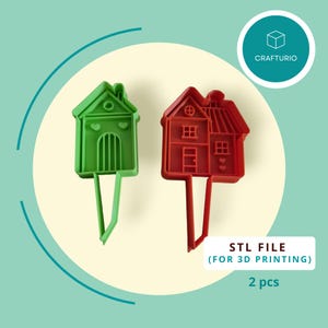 May include: Two house-shaped cookie cutters, one green and one red, with a handle. The image includes the text "STL FILE (FOR 3D PRINTING)" and "2 pcs". A logo for Crafturio is in the upper right corner.