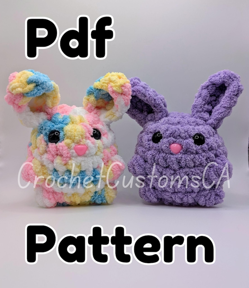 May include: PDF pattern for crocheting two bunny plushies. One bunny is multi-colored with pink, blue, yellow, and white yarn. The other bunny is purple. Both bunnies have black eyes and pink noses.