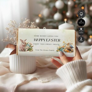 May include: A printable Easter chocolate bar wrapper with a bunny rabbit, flowers, and a chick. The wrapper says "Some bunny loves you Happy Easter Enjoy this sweet treat from The Grants Family".