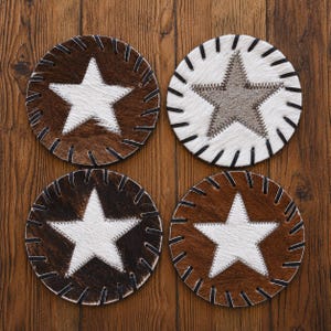 four circular coasters with star designs, each with a different color and pattern.