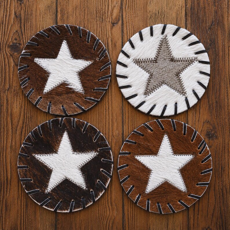 four circular coasters with star designs, each with a different color and pattern.