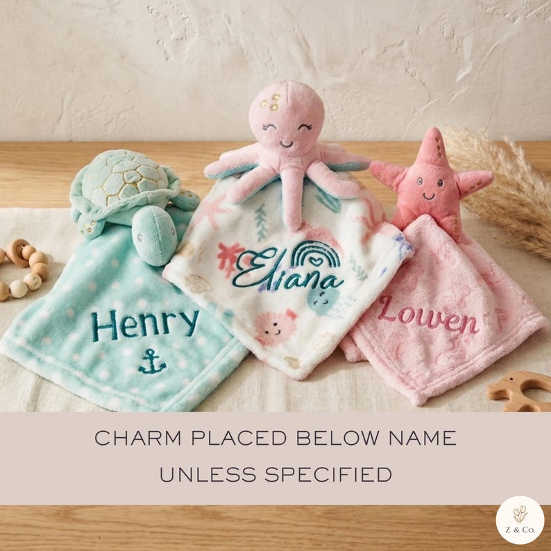 A collection of plush toys, including an octopus, a turtle, and a starfish, arranged on a wooden surface. The toys are labeled with the names Henry and Owen.