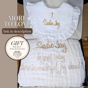 a gift packaging with a white cloth and a gold embroidered message that reads "Sadie Joy be good today there is wonderful joy ahead".