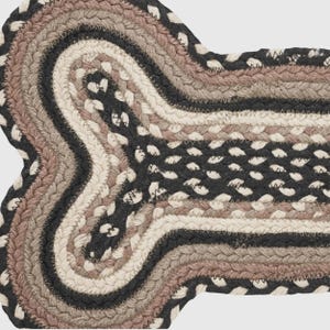 Farmhouse Style Braided Pet Mat with natural jute woven craftsmanship. A durable dog bone shaped placemat that protects floors adds rustic charm and enhances eco friendly kitchen and pet decor.