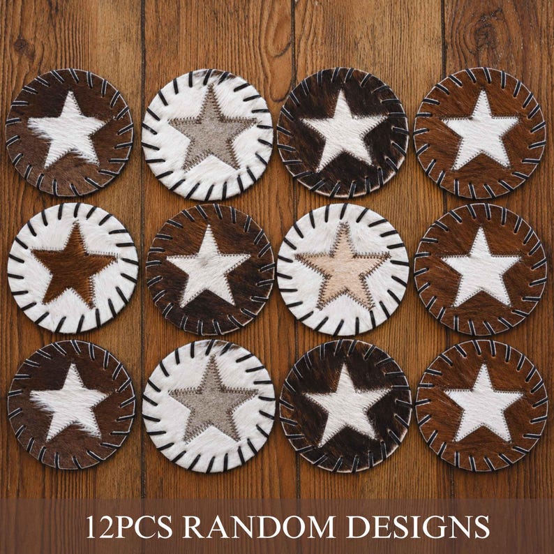 a collection of 12 coasters with various star designs, arranged on a wooden surface.