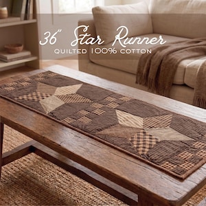 May include: A 36-inch quilted table runner made of 100% cotton, featuring a repeating star pattern in shades of brown, tan, and cream. The design incorporates checkered and striped fabric patches, finished with a stitched border edge.