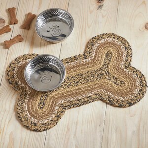 Natural Fiber Woven Braided Pet Mat offering floor protection in a farmhouse style. Eco jute dog bone placemat with rustic vintage design ideal for kitchen decor and sustainable pet accessories. Natural Fiber Placemat Woven Table Mat Rustic Dining Protection Rectangular Kitchen Accessory Farmhouse Style Decor Vintage Design Element Eco Friendly Material Sustainable Home Product Handcrafted Textile Creation Country Table Setting