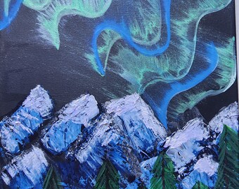 May include: Acrylic painting of a night landscape featuring mountains, trees, and the aurora borealis. The mountains are painted in shades of blue and white, with green trees in the foreground. The aurora is depicted in blue and green hues against a dark background.