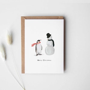 Kerstkaartpinguïn en sneeuwpop