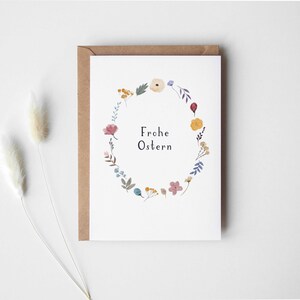 Scheda Corona floreale di buona Pasqua