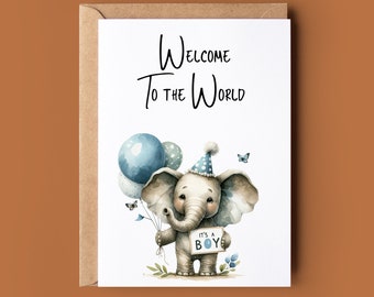 Puede incluir: Una tarjeta blanca con el texto "Bienvenido al mundo" y una ilustración de dibujos animados de un elefante gris que lleva un gorro de fiesta azul y blanco y sostiene globos azules. El elefante sostiene un cartel que dice "It's a Boy".