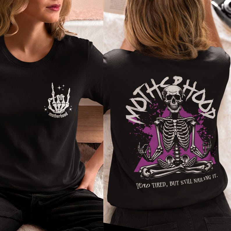 May include: Black t-shirt with a skeleton graphic and the text "MOTHERHOOD DEAD TIRED, BUT STILL NAILING IT." on the back. The front of the shirt has a white hand with the text "motherhood" underneath.