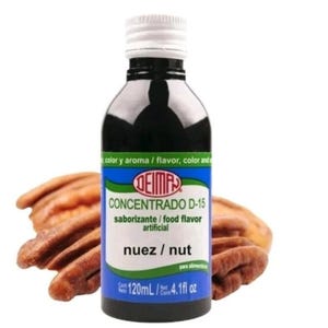 May include: A bottle of DEIMA Concentrado D-15 food flavor with a white cap and a blue label. The label reads "nuez / nut" and "120mL / 4.1 fl oz". Pecans are in the background.