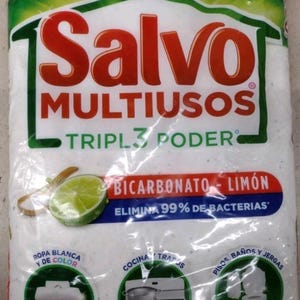 May include: A white bag of "Salvo Multiusos" laundry detergent. The bag features green and red text, with the words "Bicarbonato - Limón" and "Elimina 99% de Bacterias". The bag also shows images of laundry, a kitchen, and a bathroom.