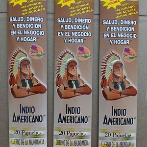 May include: Three identical rectangular incense packages featuring a brown background with a graphic of a person wearing a feathered headdress. Text includes "MÁS AROMA", "SALUD, DINERO Y BENDICIÓN EN EL NEGOCIO Y HOGAR", "INDIO AMERICANO", and "20 Pajuelas".