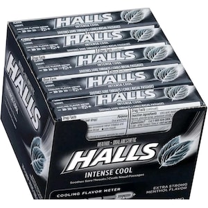 May include: A white ceramic mug with a black handle and the text "But First, Coffee" in a black, handwritten-style font. The mug is on a white surface.