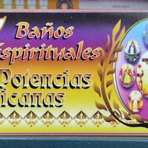 May include: A box with the words "7 Baños Espirituales Siete Potencias Africanas" in gold and white lettering. The box has a gradient background of purple, orange, and yellow. A circular image with religious figures is on the right.