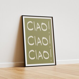 May include: A framed print with a green background and the word "CIAO!" repeated three times in white.