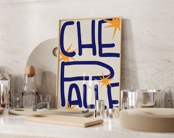 May include: A framed print with a white background and blue text that says "CHE PALI" with orange starbursts around the text.