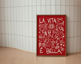 May include: A red framed print with white text that reads "La Vita e Bella" and features a variety of white illustrations of Italian food, drinks, and objects.