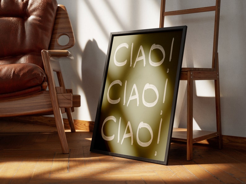 May include: A framed print with a green background and the word "CIAO!" written three times in white. The print is leaning against a wooden ladder.