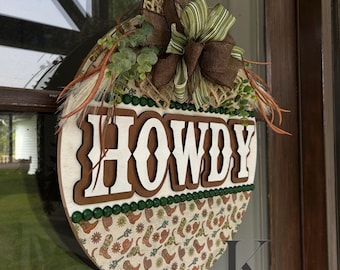 Okrągły wieszak na drzwi Howdy 18” w stylu western. Kowbojskie buty i kaktusy.