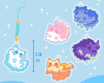 Puede incluir: Encantos Cloud Cat Gacha con cinco gatos nube diferentes con diferentes colores y expresiones. Los encantos miden aproximadamente 3 cm de alto.