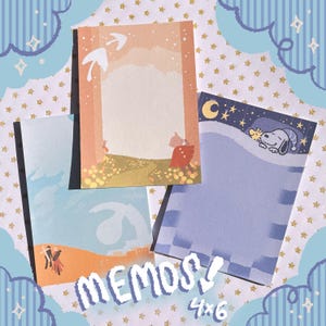 May include: A set of four memo pads with different designs. The first pad features a light pink background with a white bird and a light blue sky. The second pad has a blue background with a white checkered pattern and a cartoon dog sleeping. The third pad has a light blue background with a white cloud and a white bird. The fourth pad has a light blue background with a white cloud and a white bird. The pads are labeled "MEMOS! 4x6".