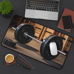 May include: A black weightlifting barbell with two black weight plates on a wooden background. The barbell is resting on the ground and the weight plates are on either side of the barbell. The weight plates have the text "100 KG" printed on them.