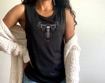 May include: Black sleeveless tank top with a graphic of a skeleton wearing a hooded robe and lifting a barbell.