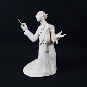 Contemporary terracotta conductor sculpture by Hélène Sellier