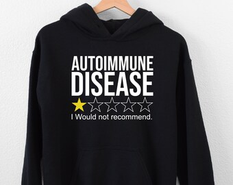May include: Black hooded sweatshirt with white text that reads "Autoimmune Disease" and a one-star rating with the text "I would not recommend."