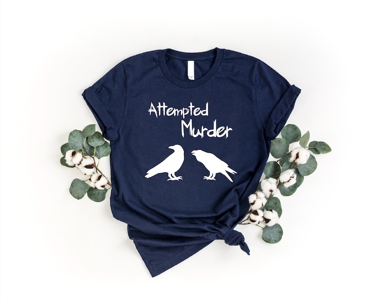 a t - shirt with two crows on it