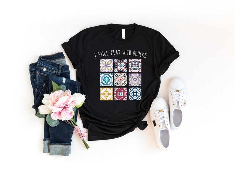 a t - shirt that says i still play with blocks