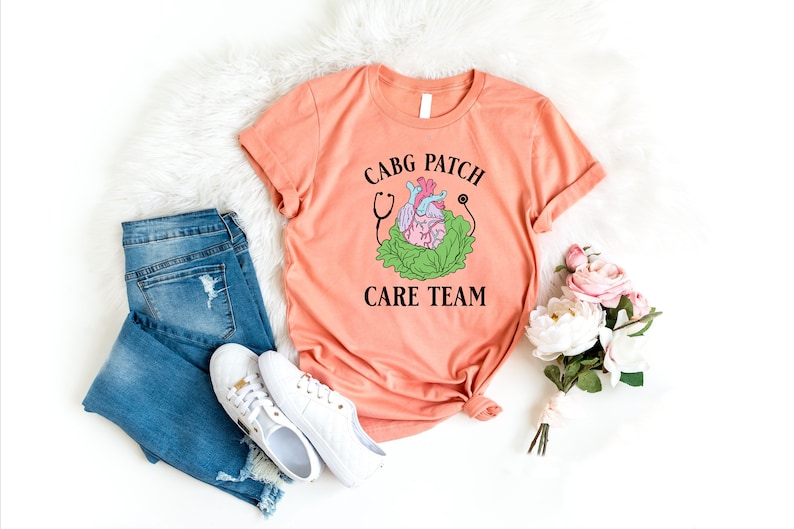 a pink t - shirt with a cartoon character on it