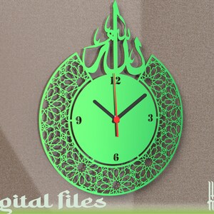 May include: Green laser cut clock with Arabic calligraphy and a geometric pattern. The clock face has black hands and red hour markers.