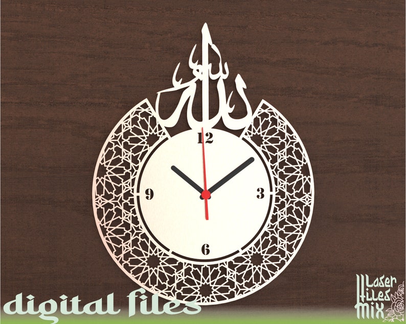 May include: White clock with Arabic calligraphy and a geometric pattern around the clock face. The clock face has black hands and red hour hand. The clock face has numbers 12, 3, 6, and 9.