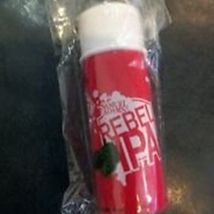 May include: A red and white cylindrical container with the text "REBEL IPA" printed on the side. The container has a white cap and is sealed in clear plastic.