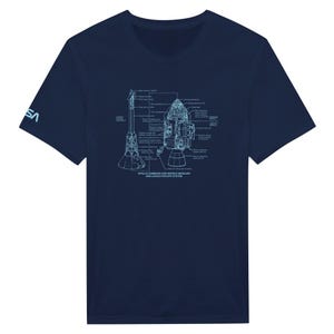 May include: A navy blue t-shirt with a white outline of the Apollo Command and Service Modules and Launch Escape System. The text "APOLLO COMMAND AND SERVICE MODULES AND LAUNCH ESCAPE SYSTEM" is printed below the image.