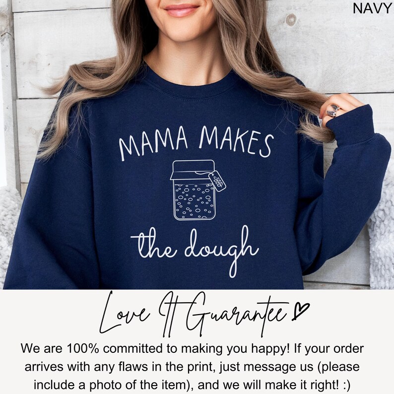 May include: Navy blue sweatshirt with the text "Mama Makes the Dough" and a graphic of a jar with dough rising. The text "Love It Guarantee" is below the graphic.