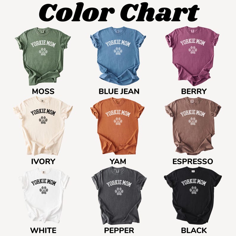 May include: A color chart displays nine t-shirts in various colors, each featuring the text "YORKIE MOM" above a paw print. Colors include moss, blue jean, berry, ivory, yam, espresso, white, pepper, and black.