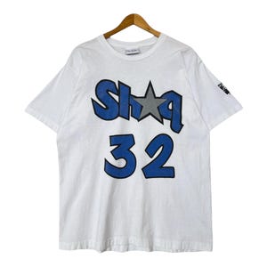 Vintage 90er Jahre Reebok Shaq 32 TShirt Made In USA Tees Vintage 90er Jahre Shaquille O&#39;neal&#39;s Vintage 90er JahreOrlando Magic White Graphic Tee Gr. L